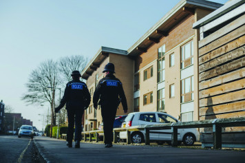 Male and female officer walking the beat in Norfolk CMYK v2