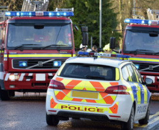 Close up of police car and two fire engines