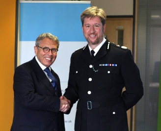Former PCC Lorne Green shaking hands with former Chief Constable Simon Bailey