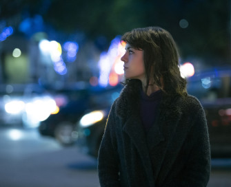 Woman in a street at night