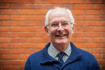 PCC Giles Orpen Smillie in jumper smiling