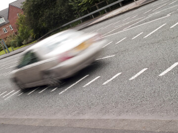 car speeding on road