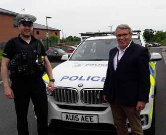 Former PCC Lorne Green and police officer with body camera