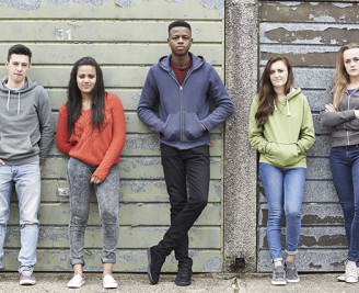 Five young people standing in a line