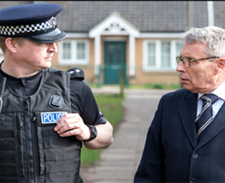 Former PCC Lorne Green walking the beat with an officer