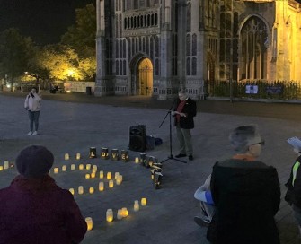 Former PCC Lorne Green speaking at night time vigil outside Norwich church