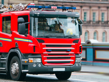 Fire engine driving across bridge