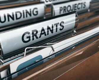 Grants - image of titled tabs in filing cabinet